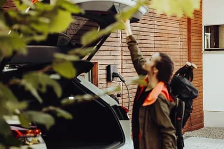 Happy Calgary EV owner with their home EV charger installed by Westland Electric